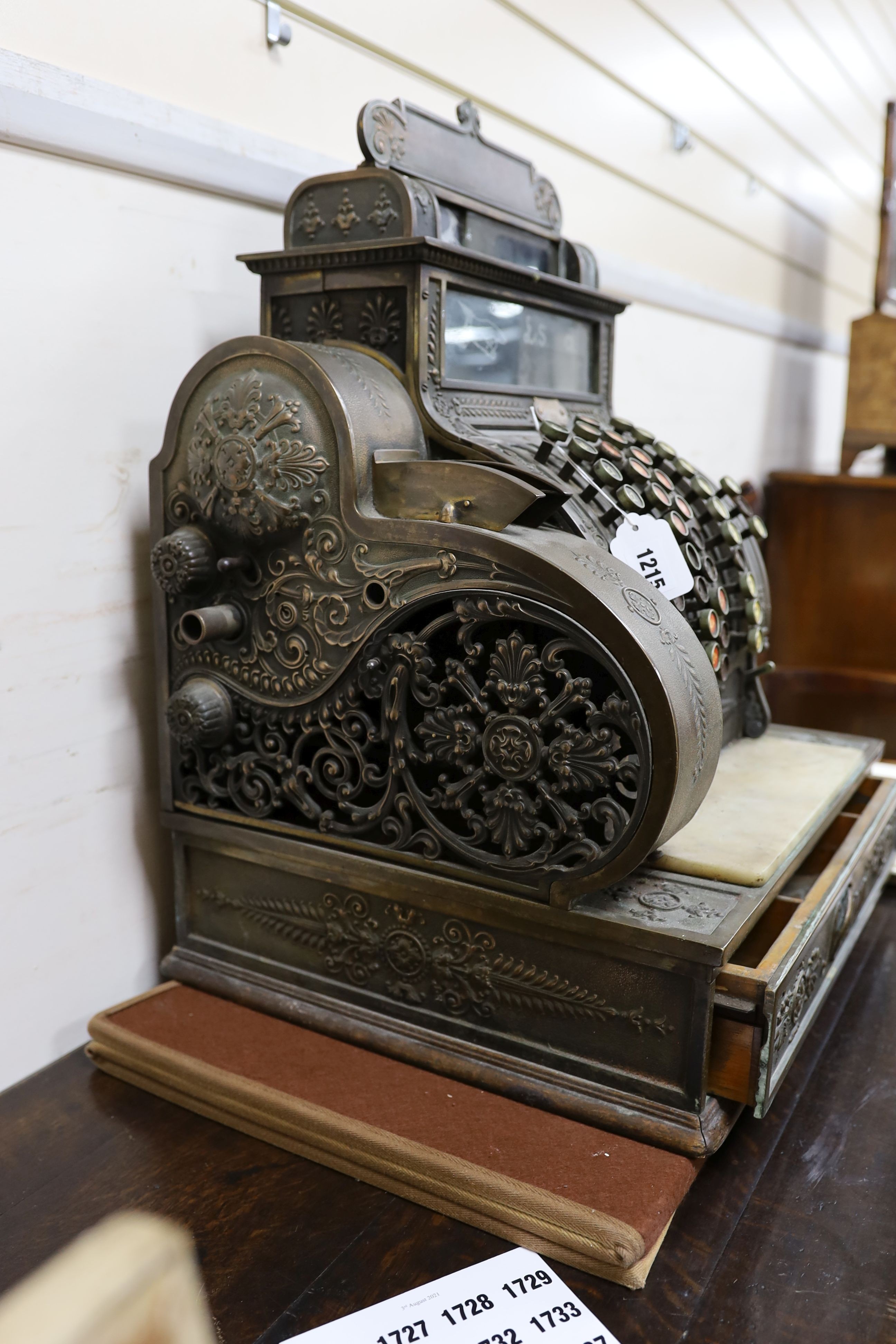 An early 20th century American National cash register, Serial Number 1068452/484, width 47cm, depth 39cm, height 57cm